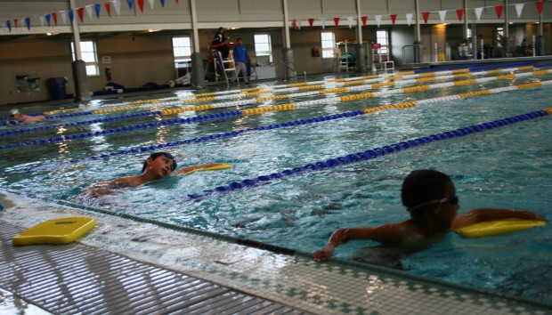 Swimmers on the Richmond Sailfish team work on flutter kicks during their weekday practice. (Photo by: Jen Baires)